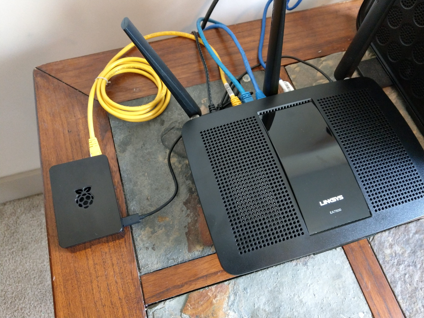 A Raspberry Pi 3 next to a wireless router